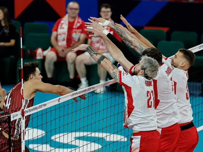 Volleyball players forming a block at the net during Poland vs Latvia at Men’s EuroVolley 2026